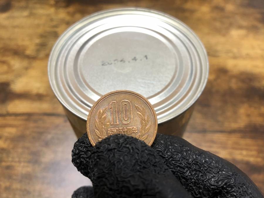 10円玉と缶詰イメージ